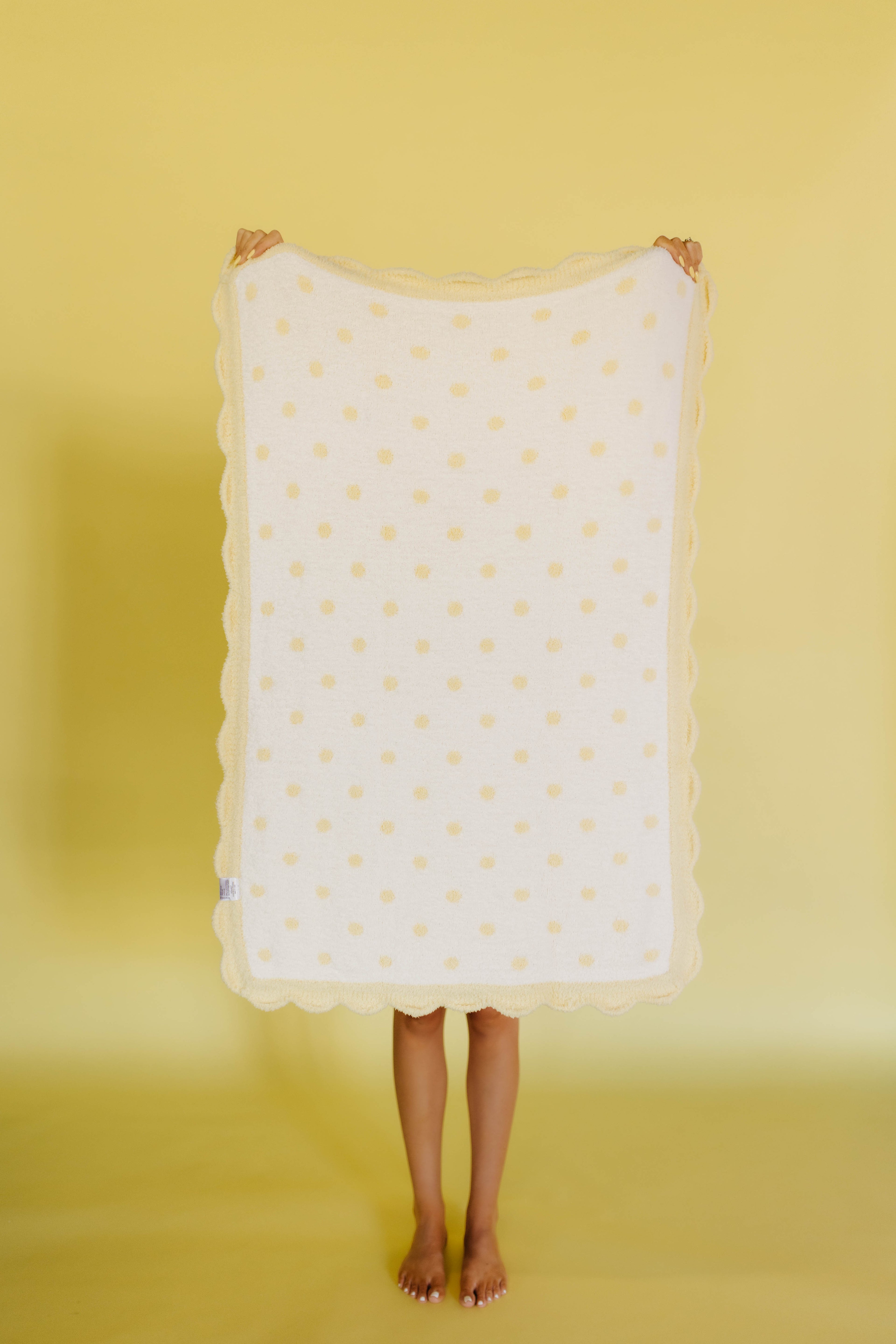 white side of the butter yellow polka dog blanket
