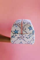 showing the handle on the cosmetic bag