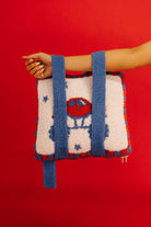 quillow being held by the blue straps