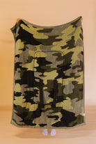 full side of camo quillow while it's being held up