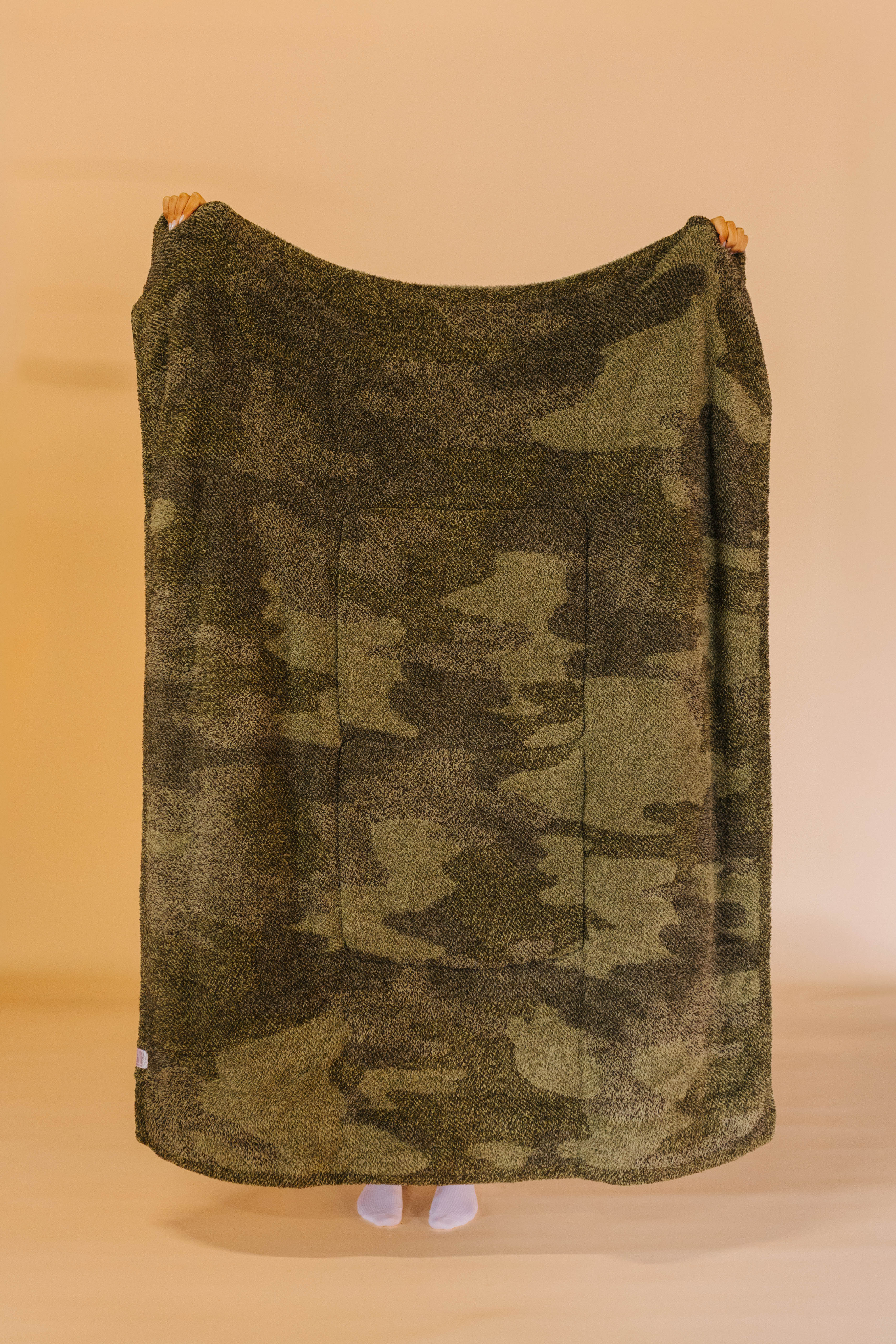 back of camo quillow showing mixed green color blanket