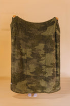 back of camo quillow showing mixed green color blanket