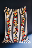 front of teddy bear blanket showing stripes and teddy 