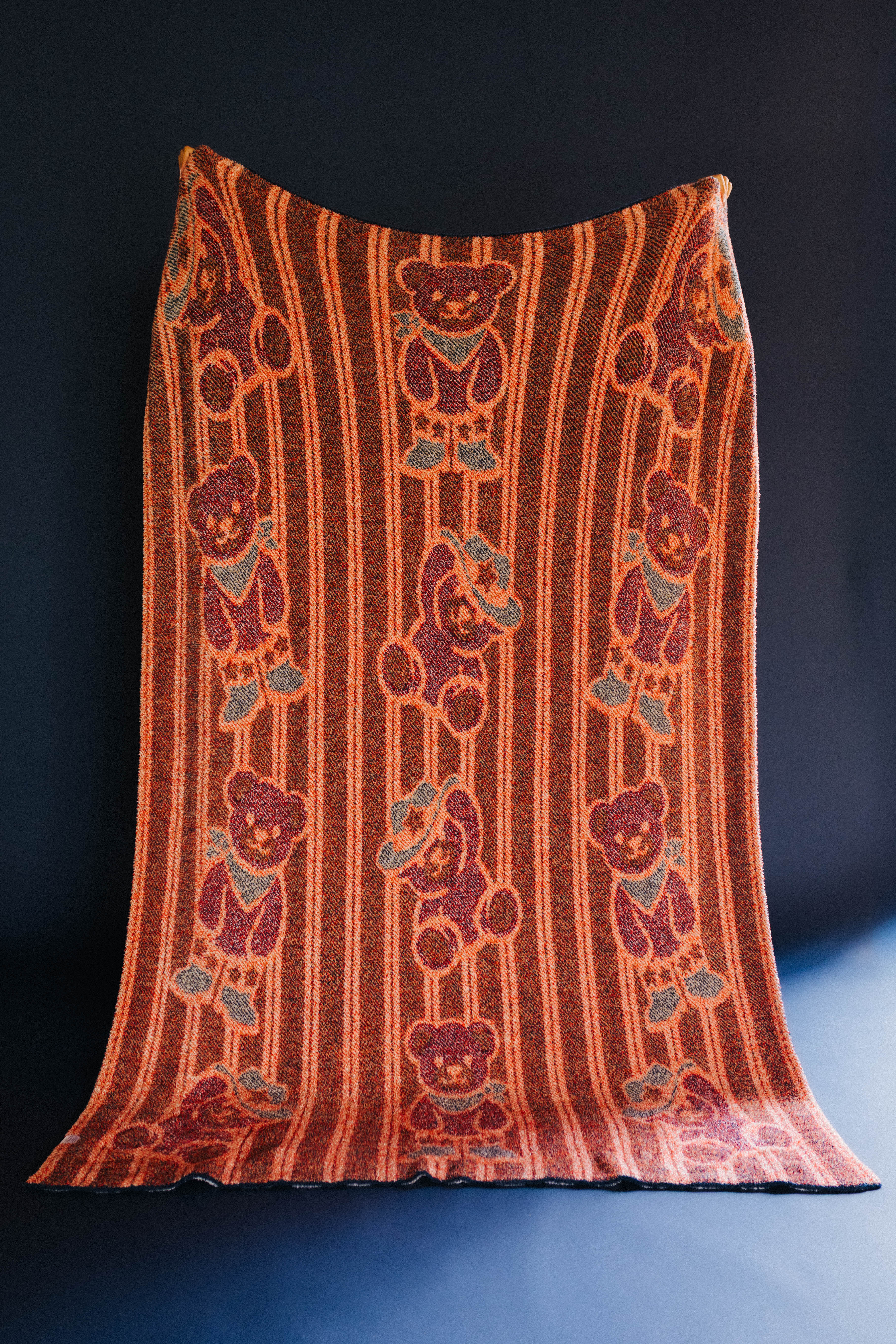 back of teddy blanket showing mostly red
