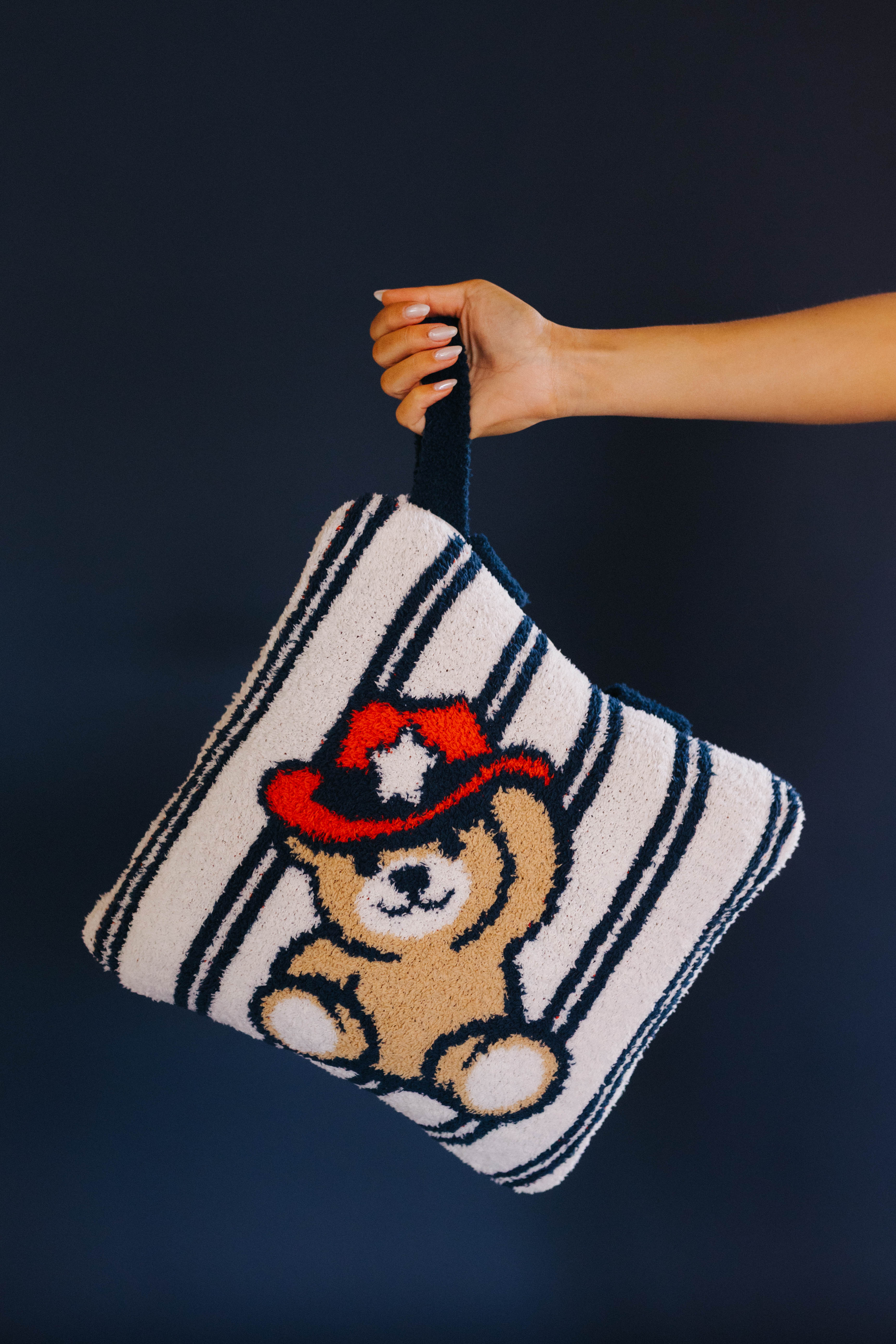holding the quillow by the wristlet
