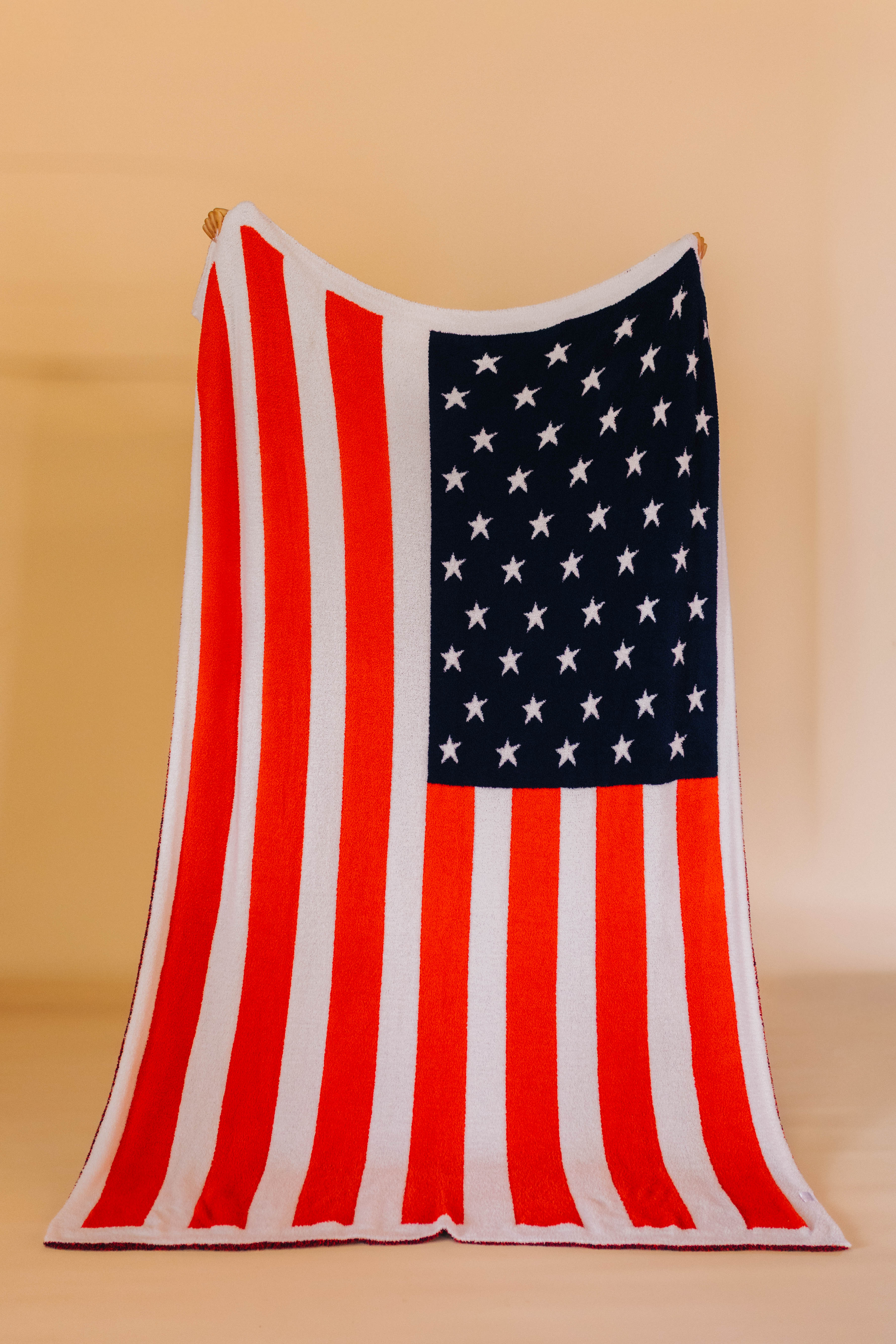 holding up the american flag blanket