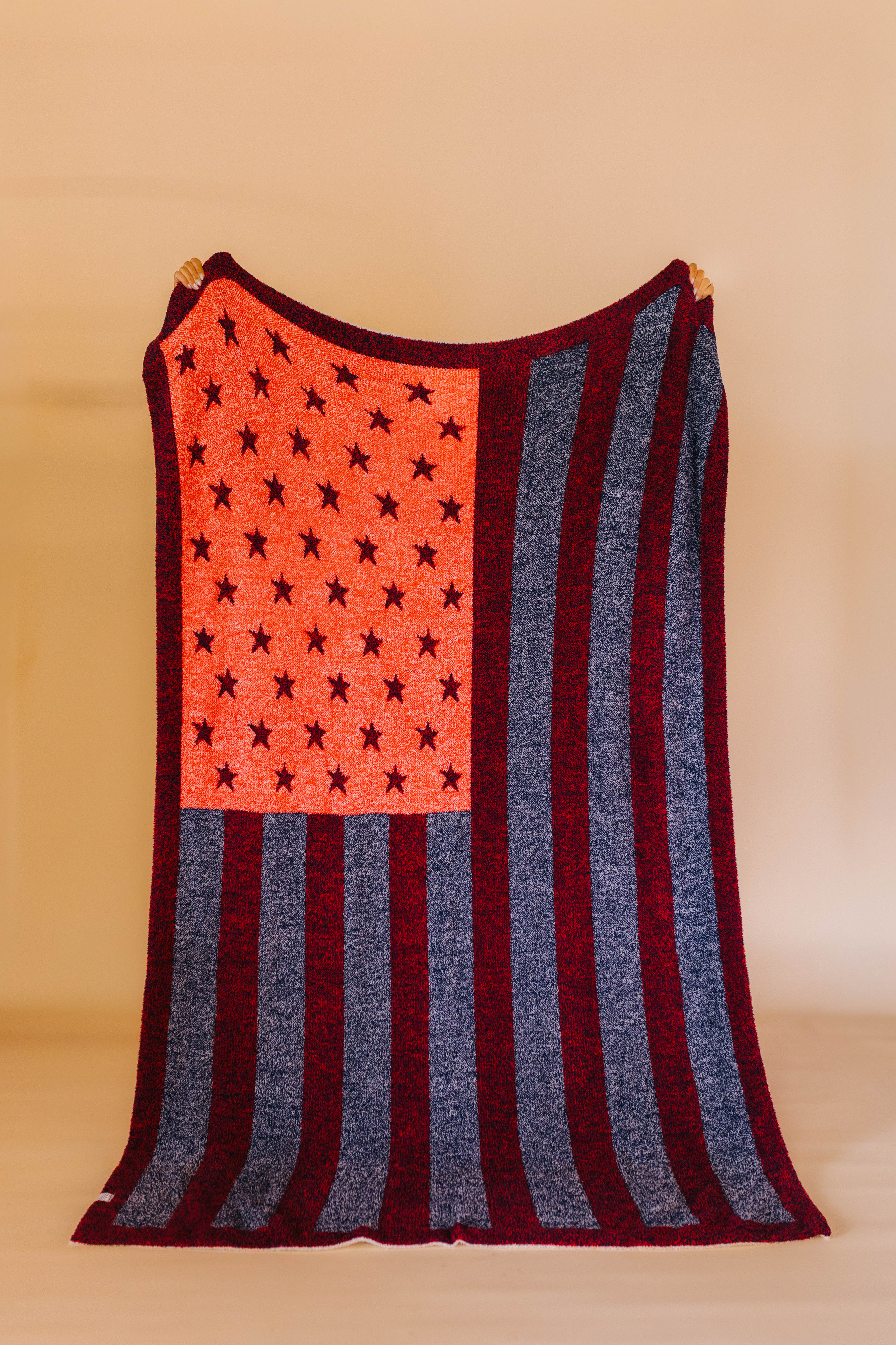 back of american flag blanket showing mostly red and blue details