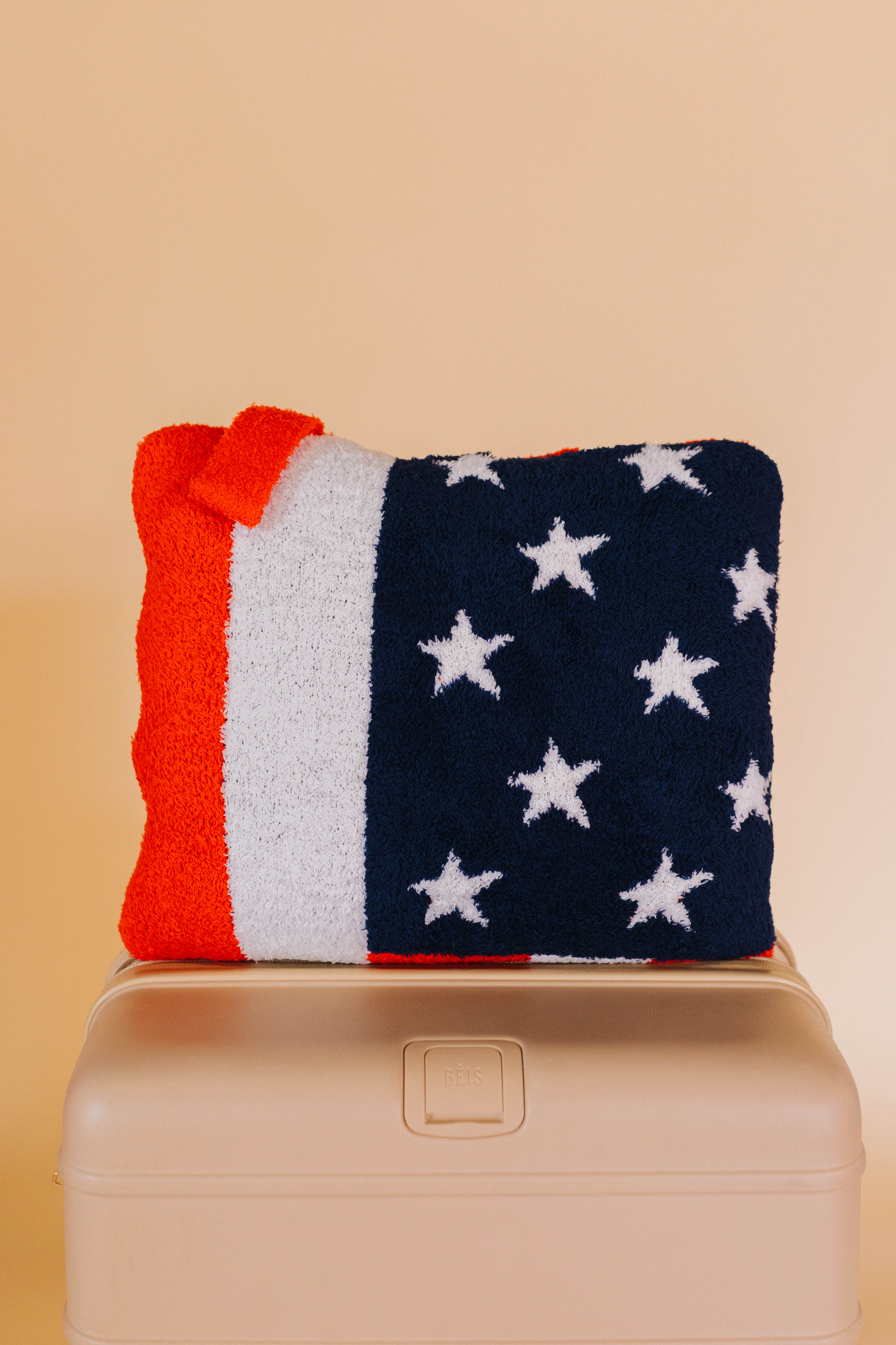 front of american flag quillow on beige bag