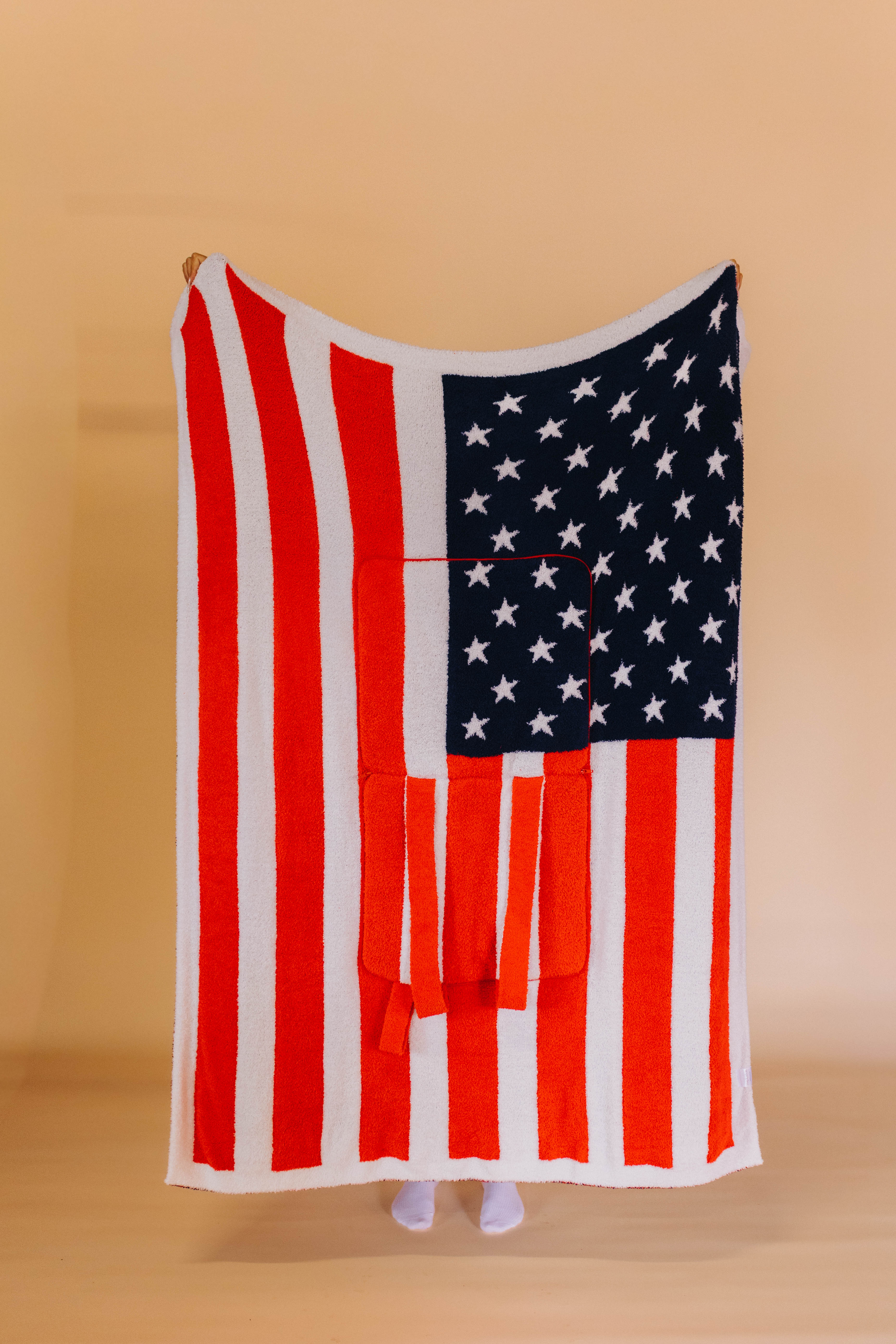 front of american flag quillow showing red stripes and white stars