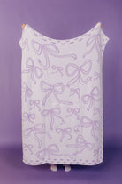 other side of the quillow showing mostly white and purple bows