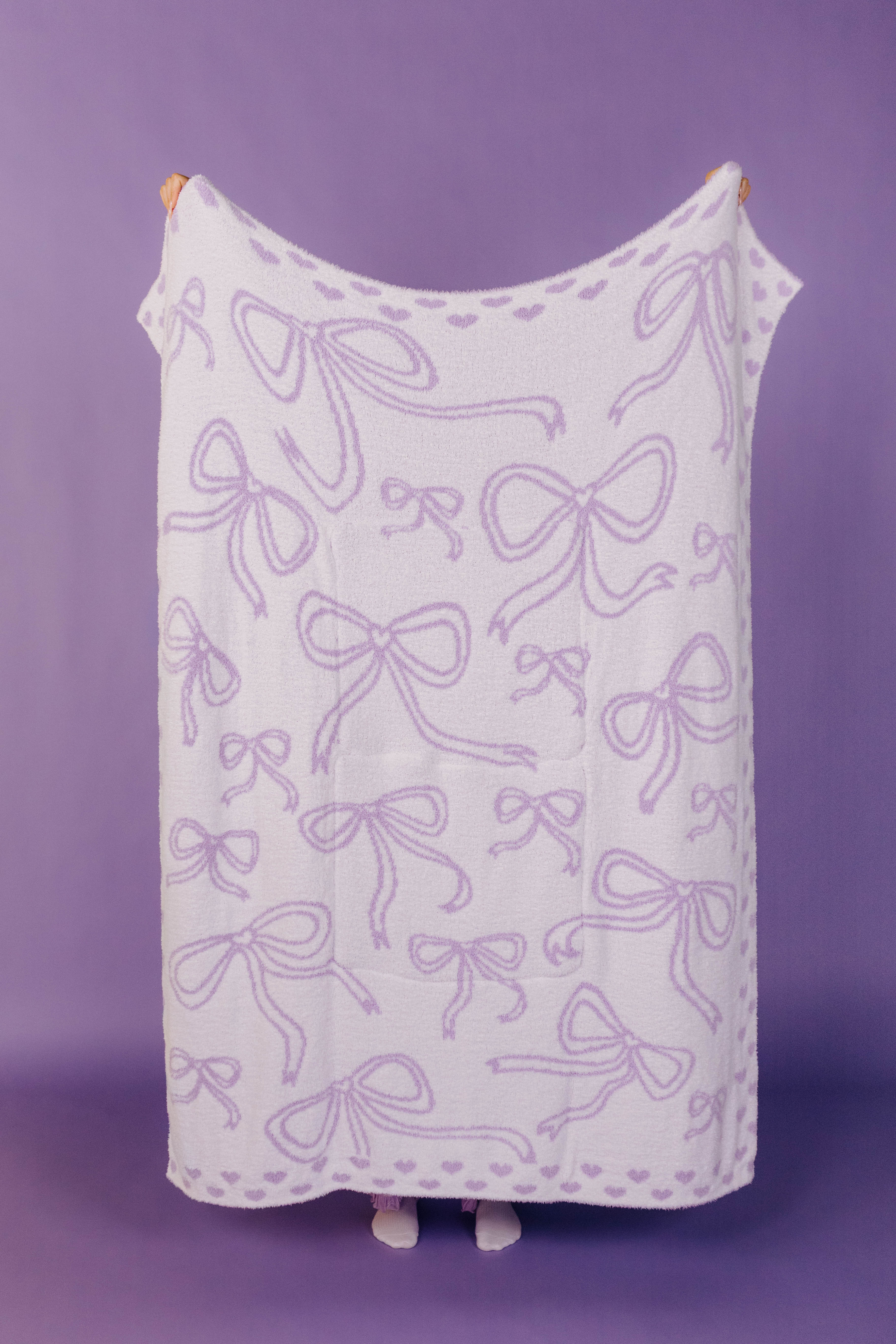 other side of the quillow showing mostly white and purple bows