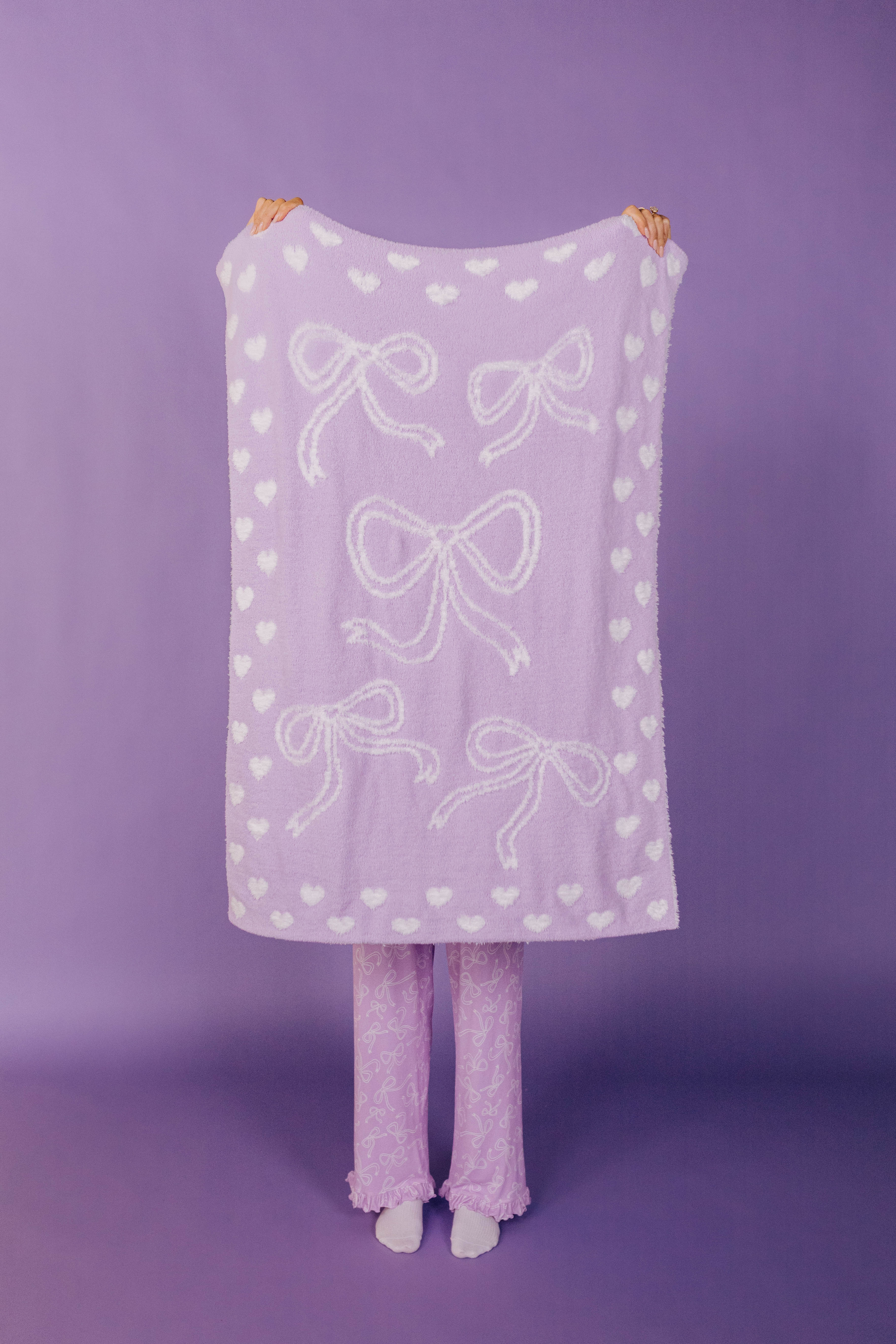 front of the purple bow blanket