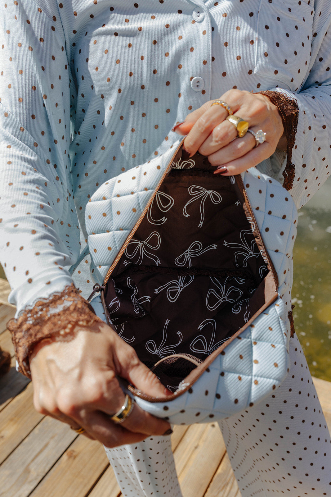 Close view of the open polka dot cosmetic bag.