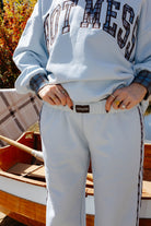 Close view of the light blue sweatpants waistband and pocket.