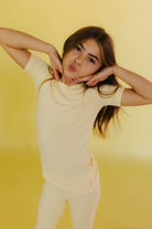 Kolly posing with a kissy face and hands under her face