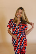 posing in gingham pjs size M