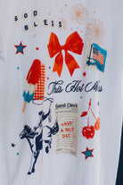 close up of the white tee with icons on it 