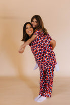 mom and daughter in matching pj - daughter on moms back