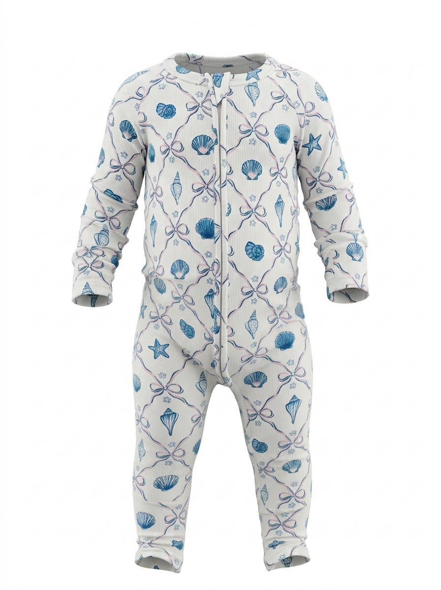 Children's onesie with blue shell themed pattern on a white background