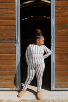 Back view of the kid brown stripe pajama top and pants.
