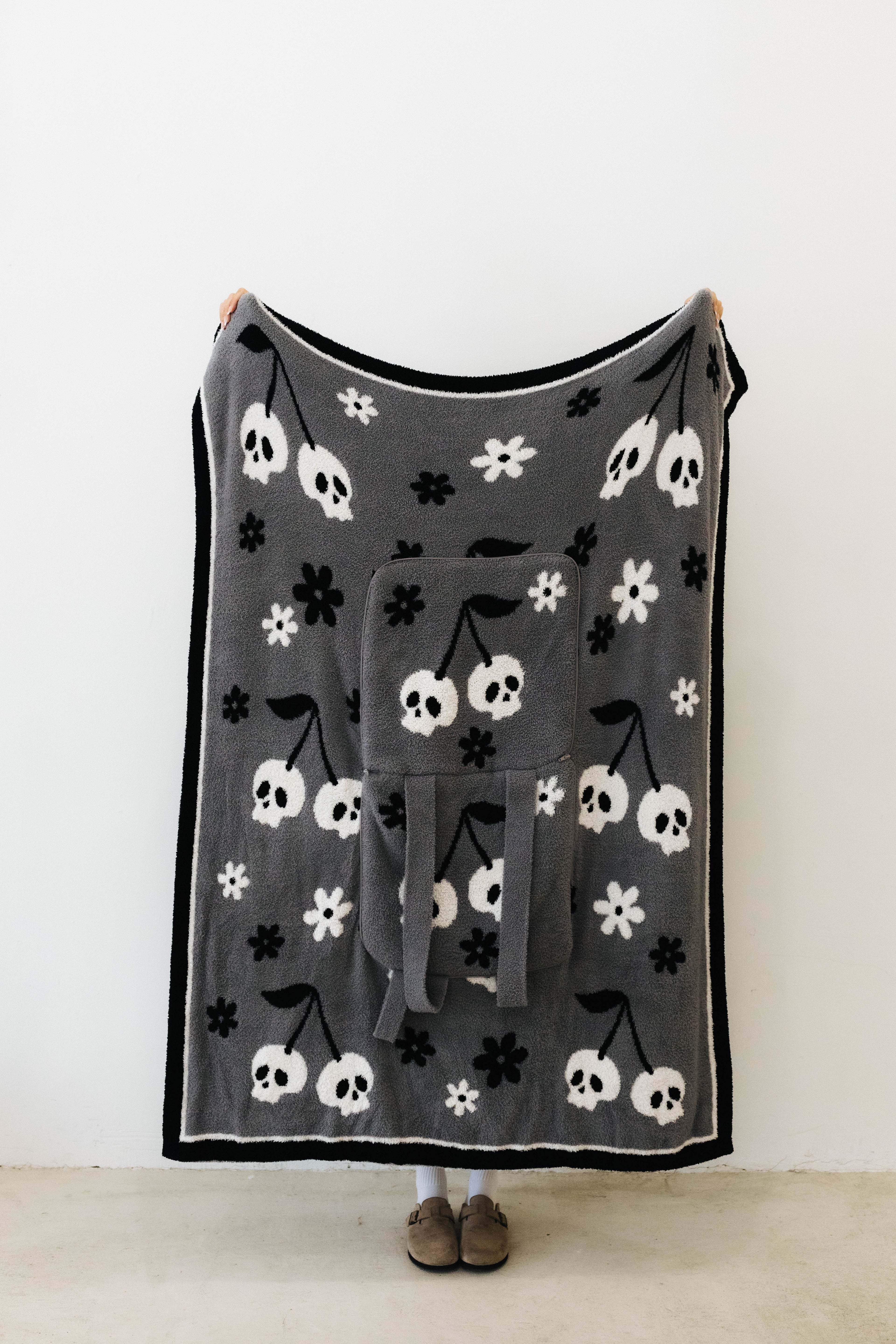 skelly backpack/wristlet quillow opened showing one side of the quillow 