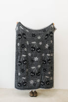 skelly backpack/wristlet quillow opened showing one side of the quillow 
