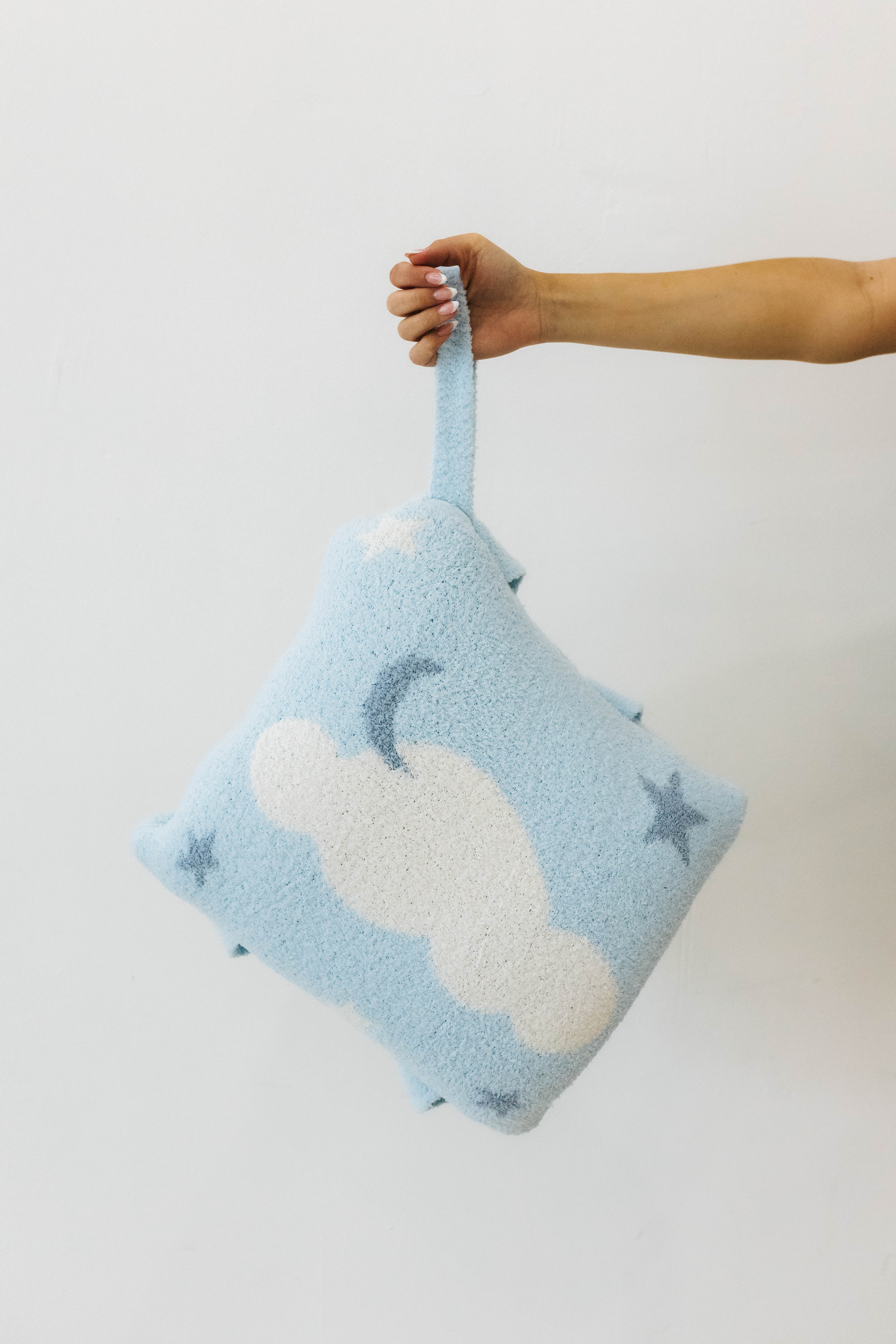 cloud backpack/wristlet quillow holding the wristlet 