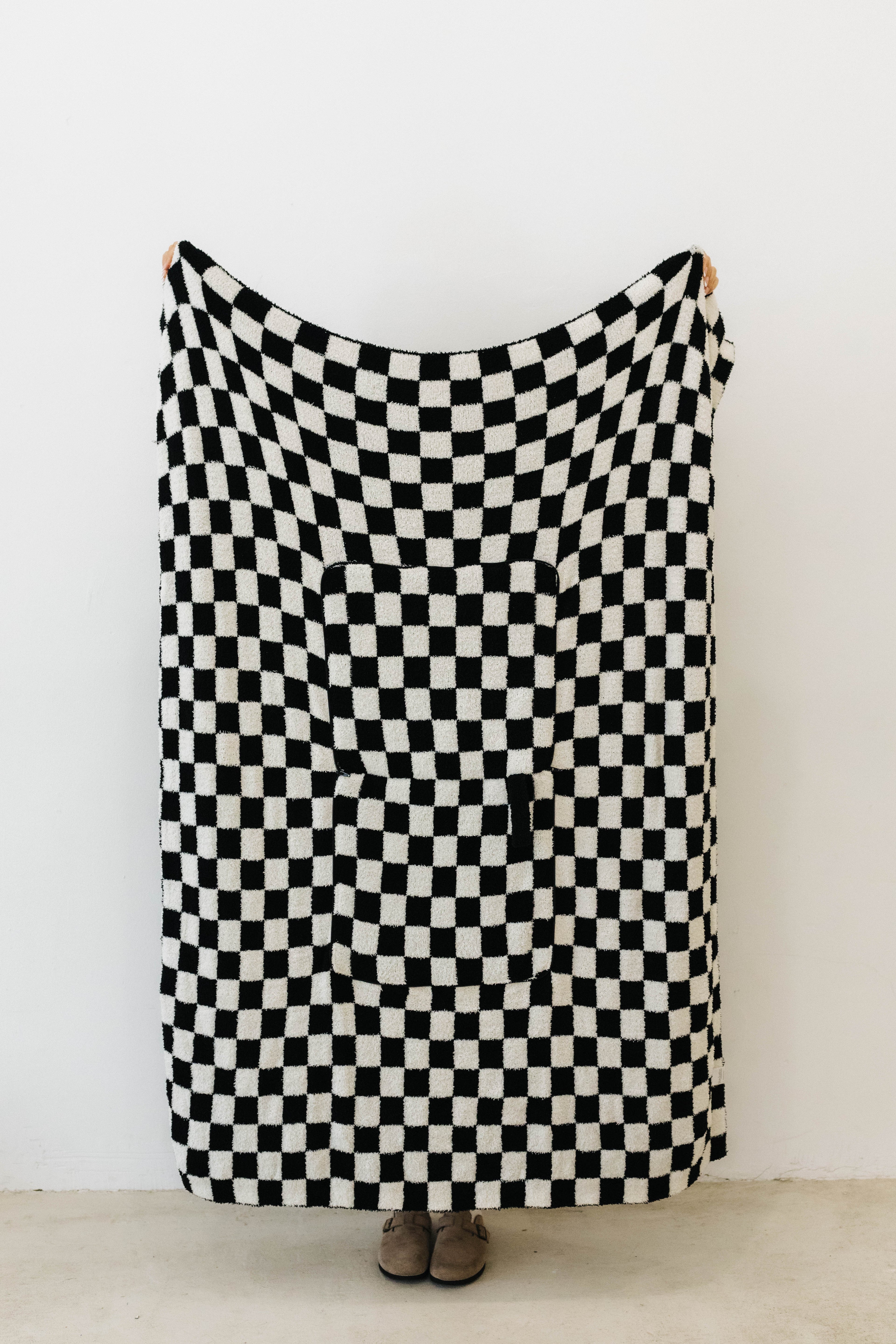 one side of black check quillow showing black and white checkered print 