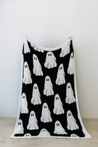 ghost blanket opened showing the black and white ghosts