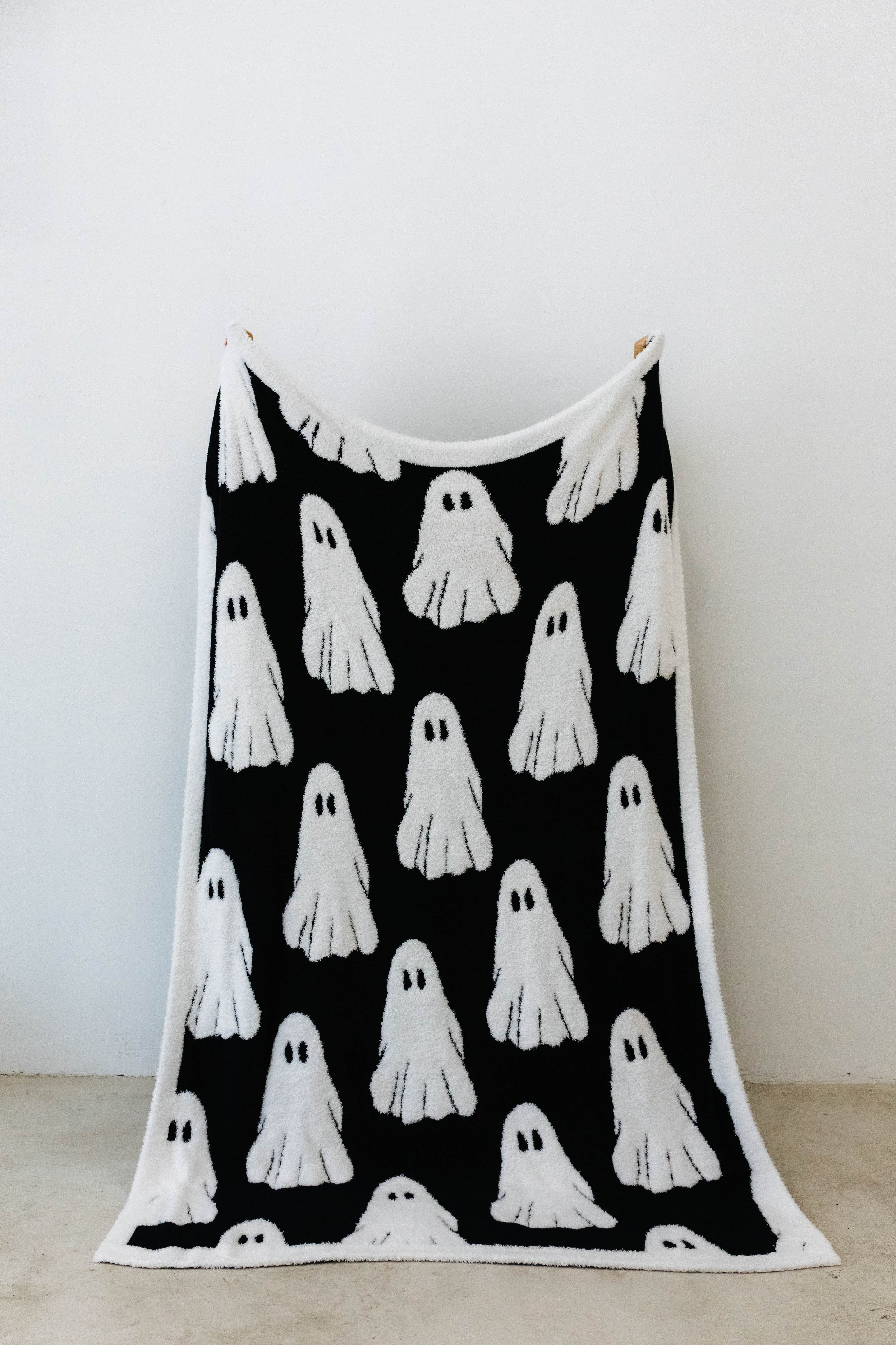 ghost blanket opened showing the black and white ghosts