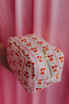 cosmetic bag showing the bow and cherry detail