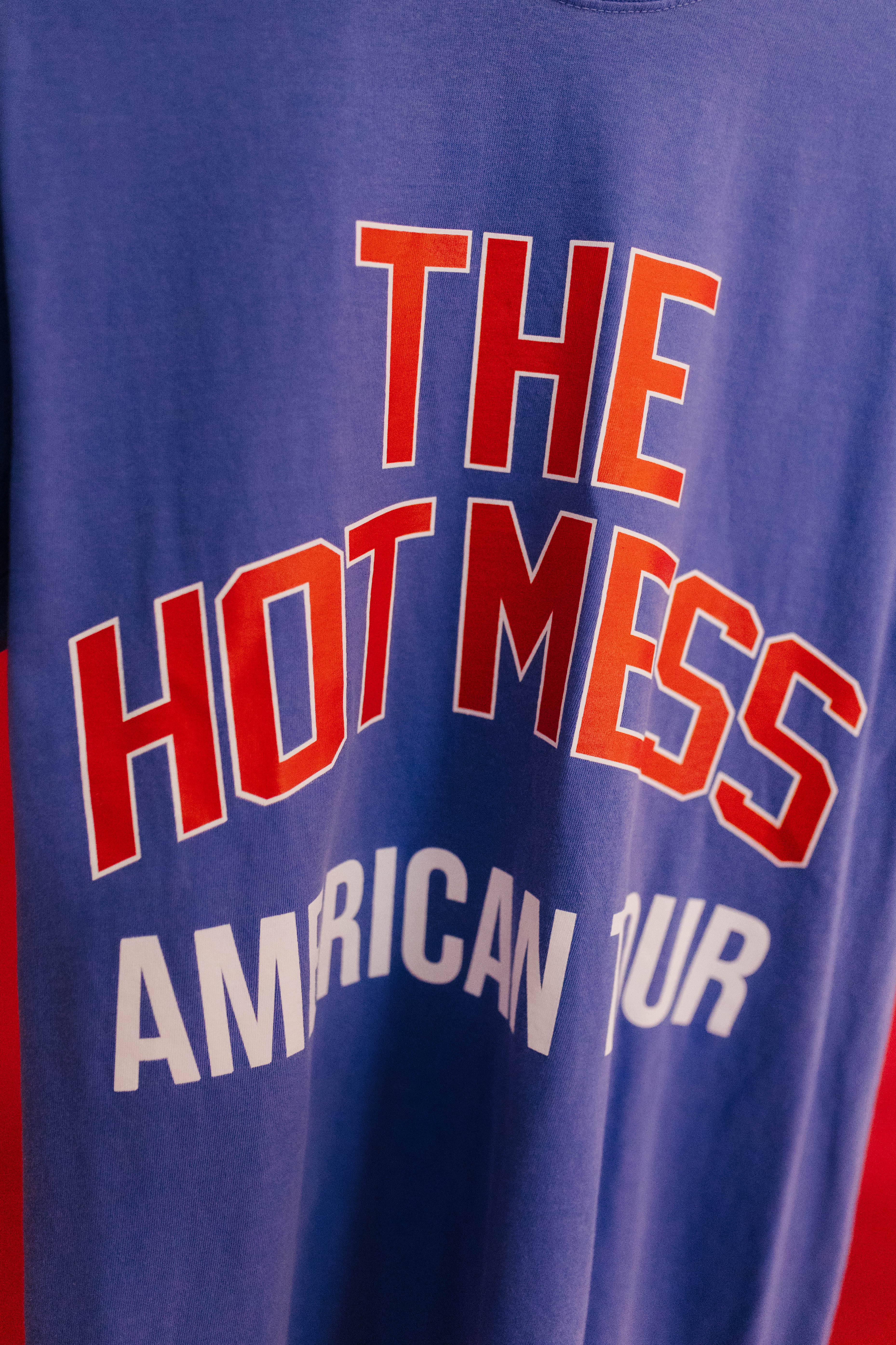 Blue t-shirt with red and white text 'THE HOT MESS AMERICAN TOUR' 