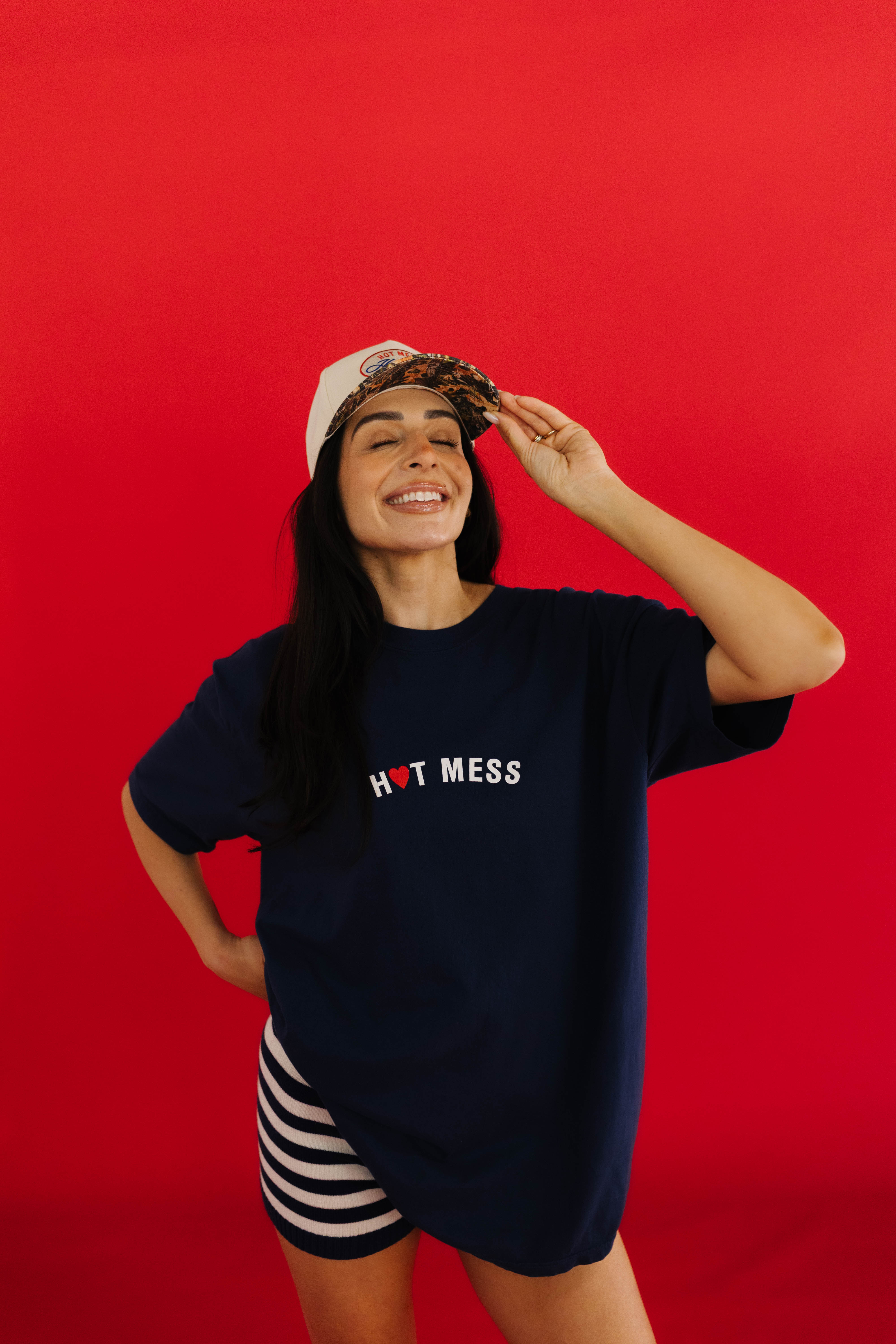 front of the hot mess tee on a red background