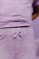 close up of purple bow detail on pj