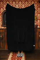 Black waffle quillow unfolded as a blanket