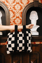 Sand & Black Check Quillow 50x60 shown in a full length lifestyle view