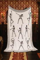 Skelly blanket held open to show the reverse side