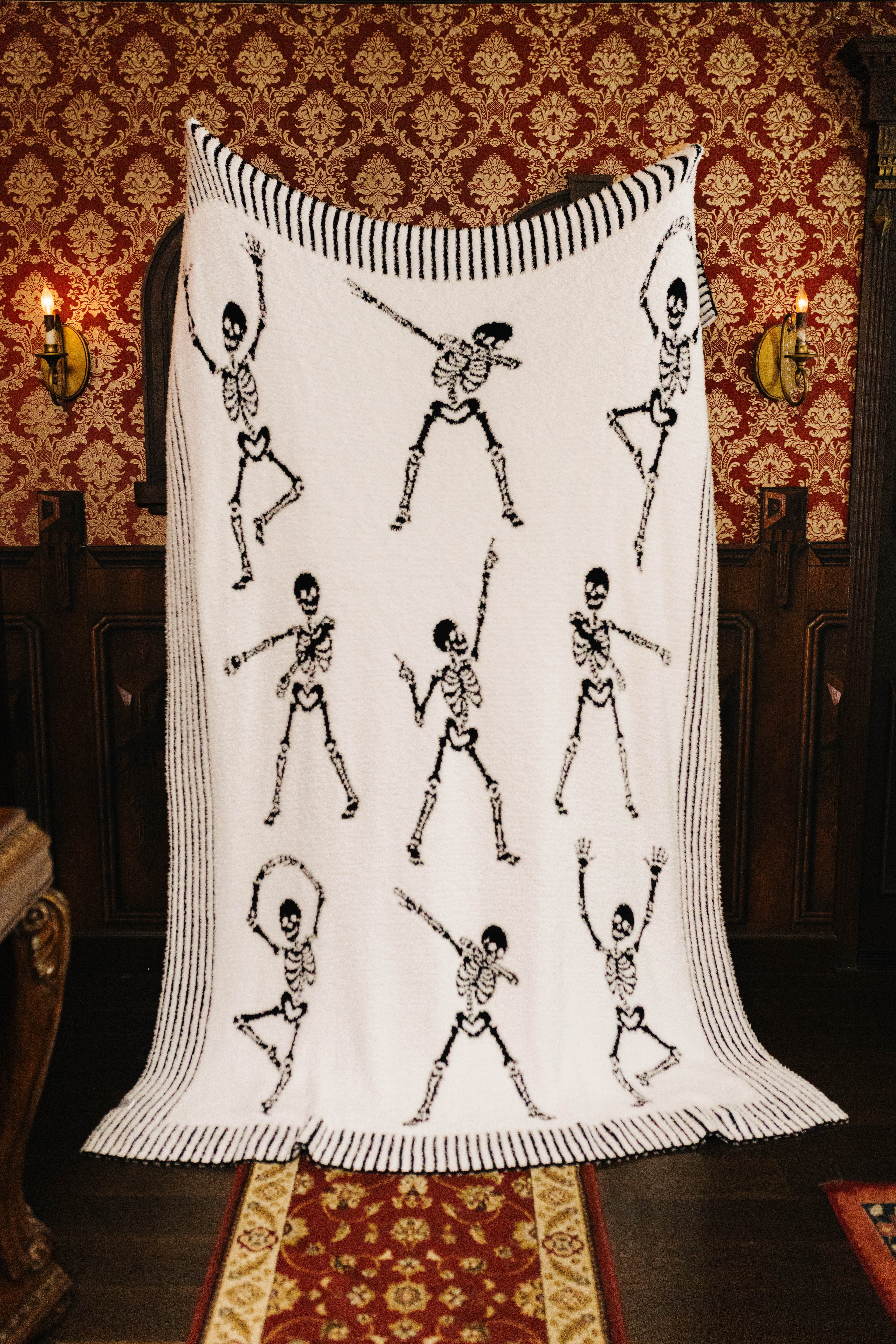 Skelly blanket held open to show the reverse side