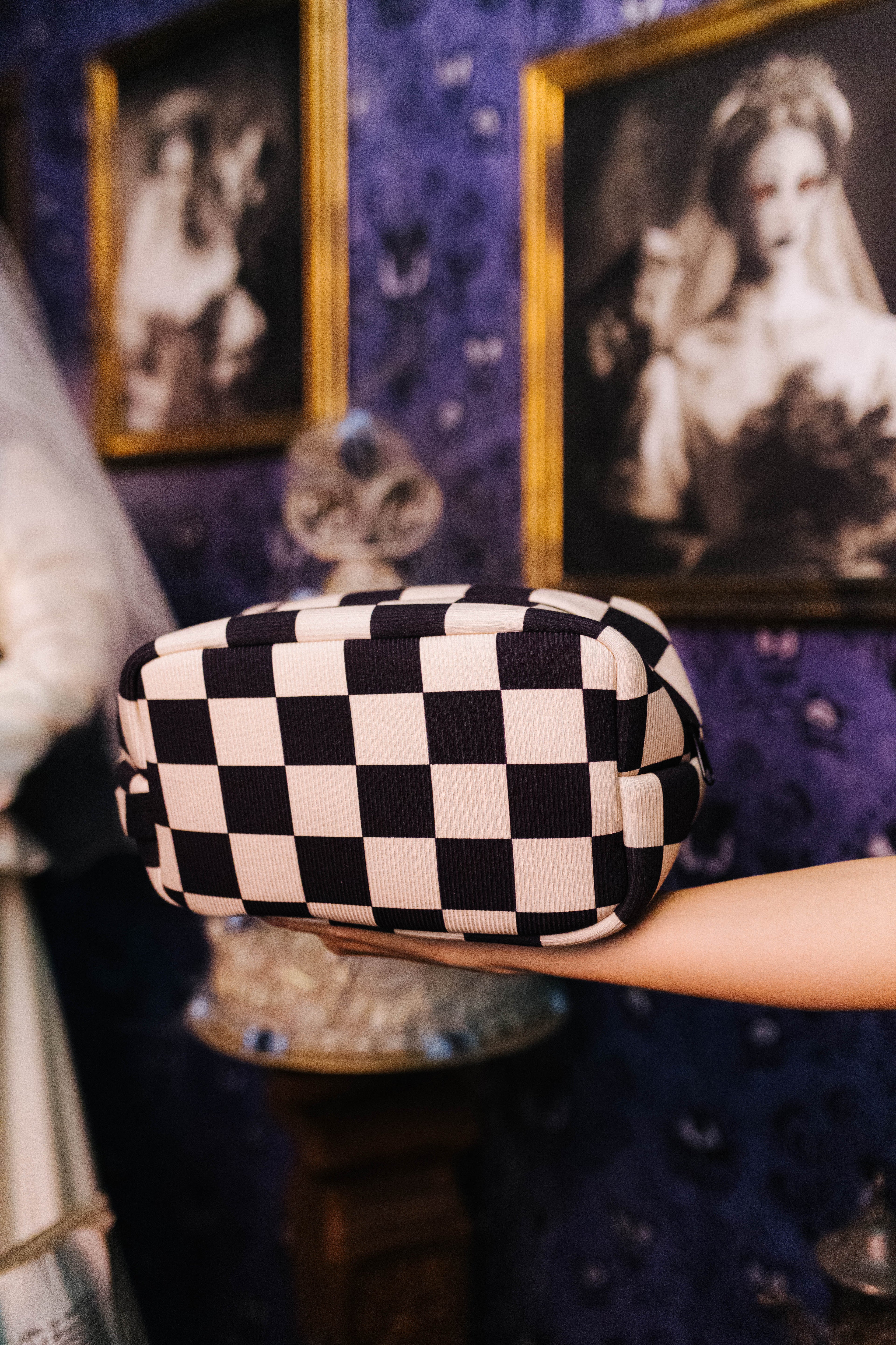Sand and black check cosmetic bag shown from the front
