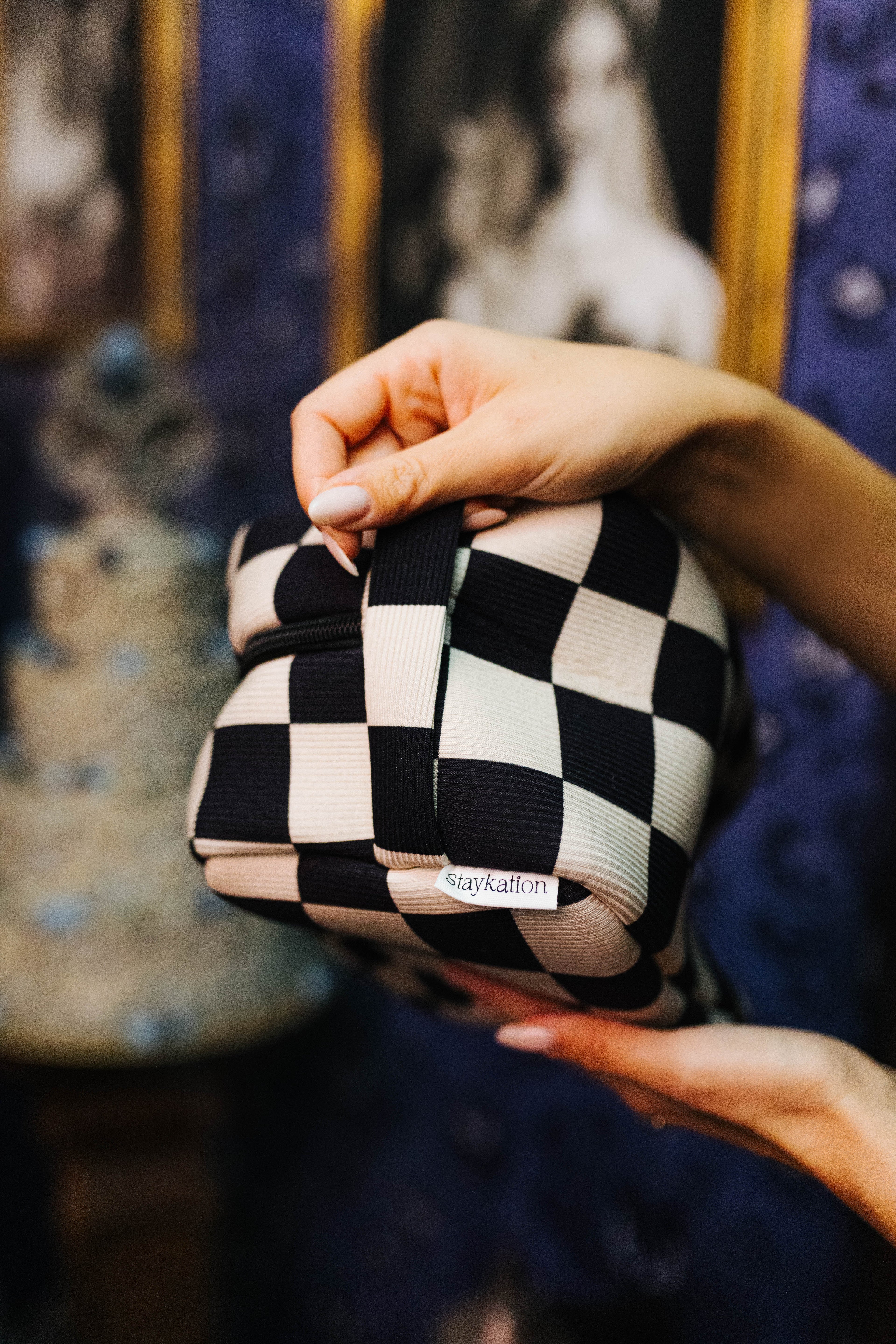 Sand & Black Check Cosmetic Bag shown in a full length lifestyle view