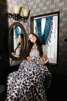 Leopard Faux Fur Blanket 60x80 shown in a full length lifestyle view