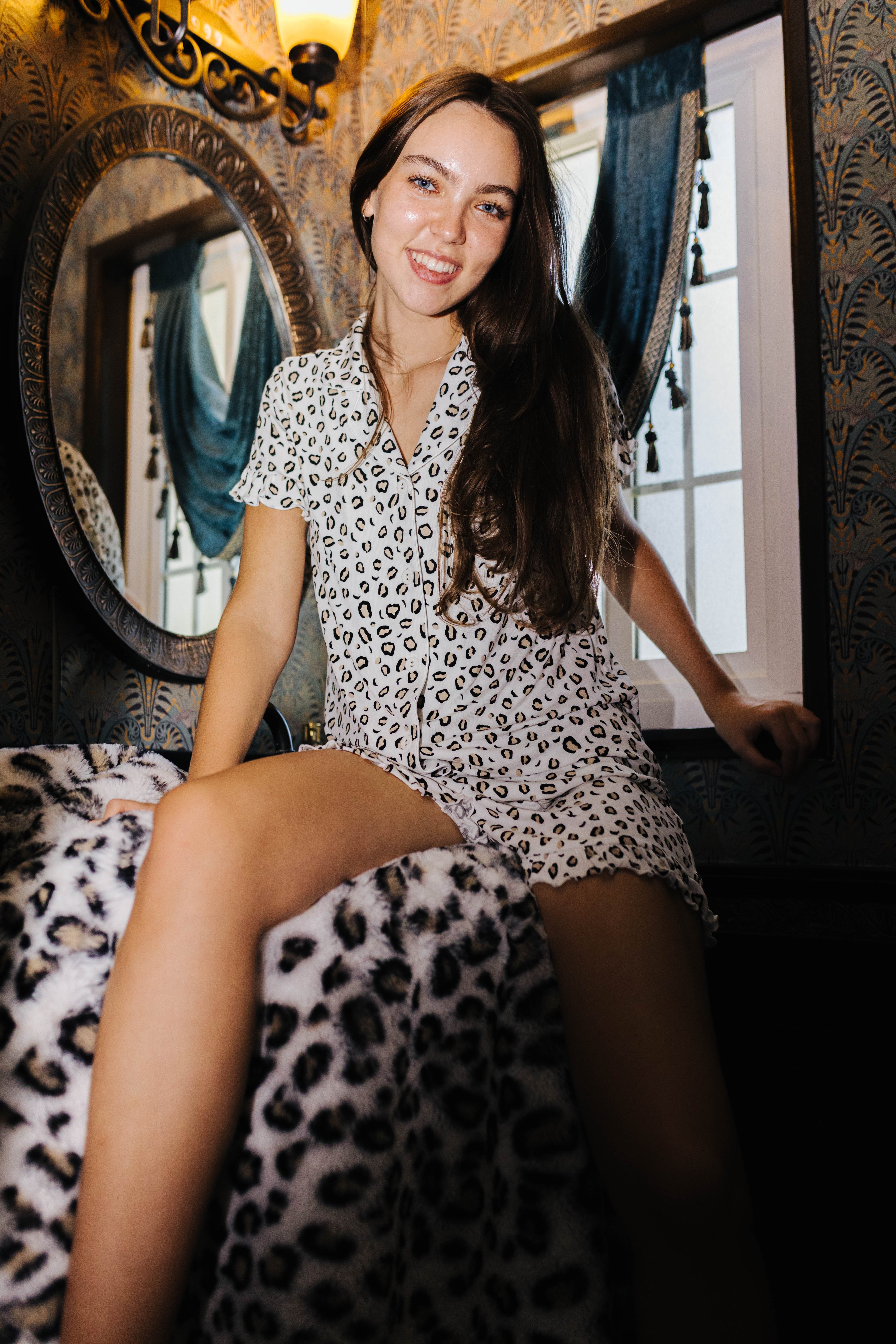Front view of adult leopard ruffle short pajamas on a model