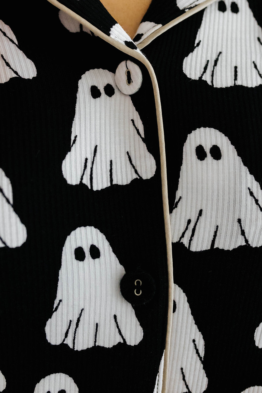 white ghost print on pajama top with beige lining 