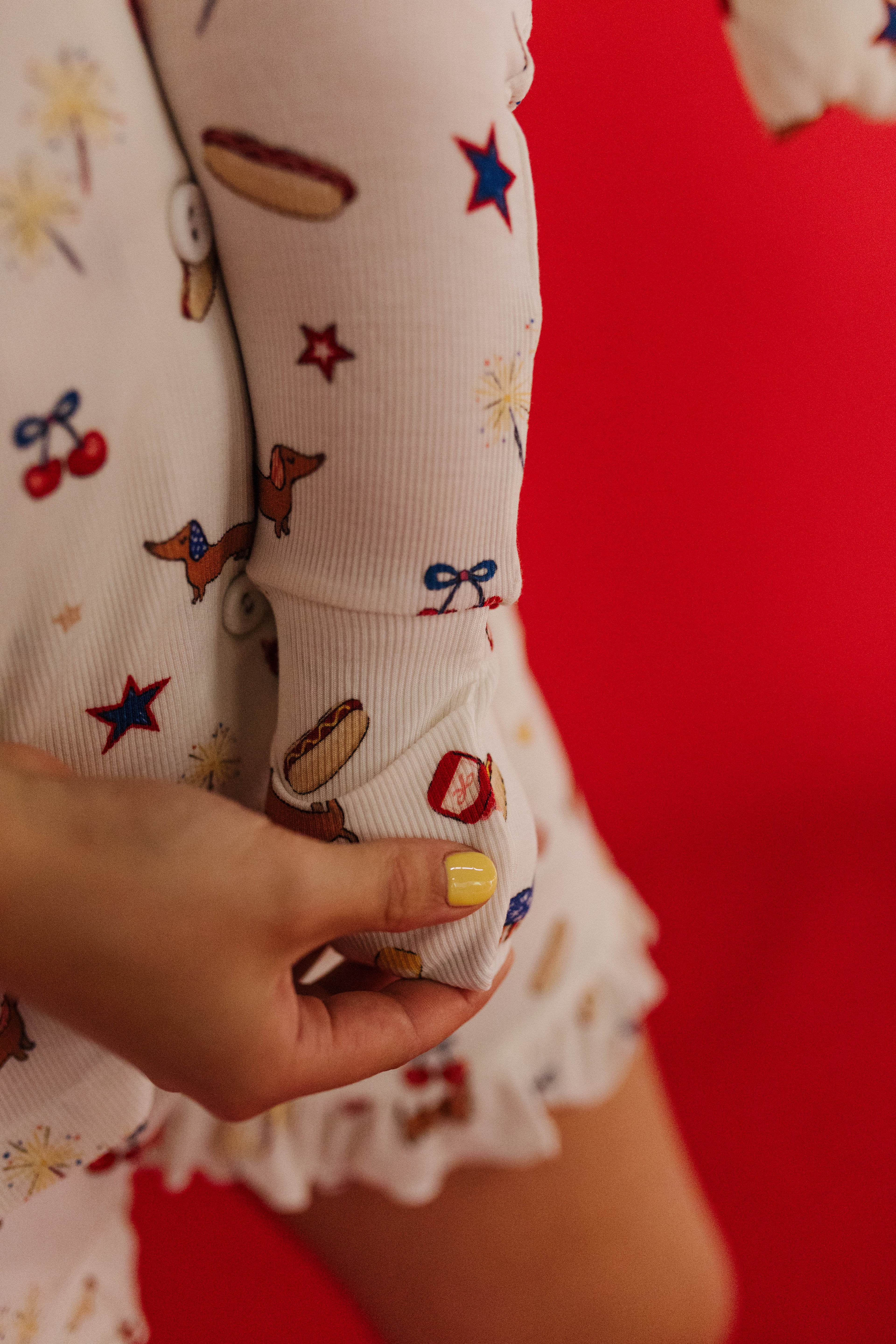 showing the foot detail of the baby pajamas 
