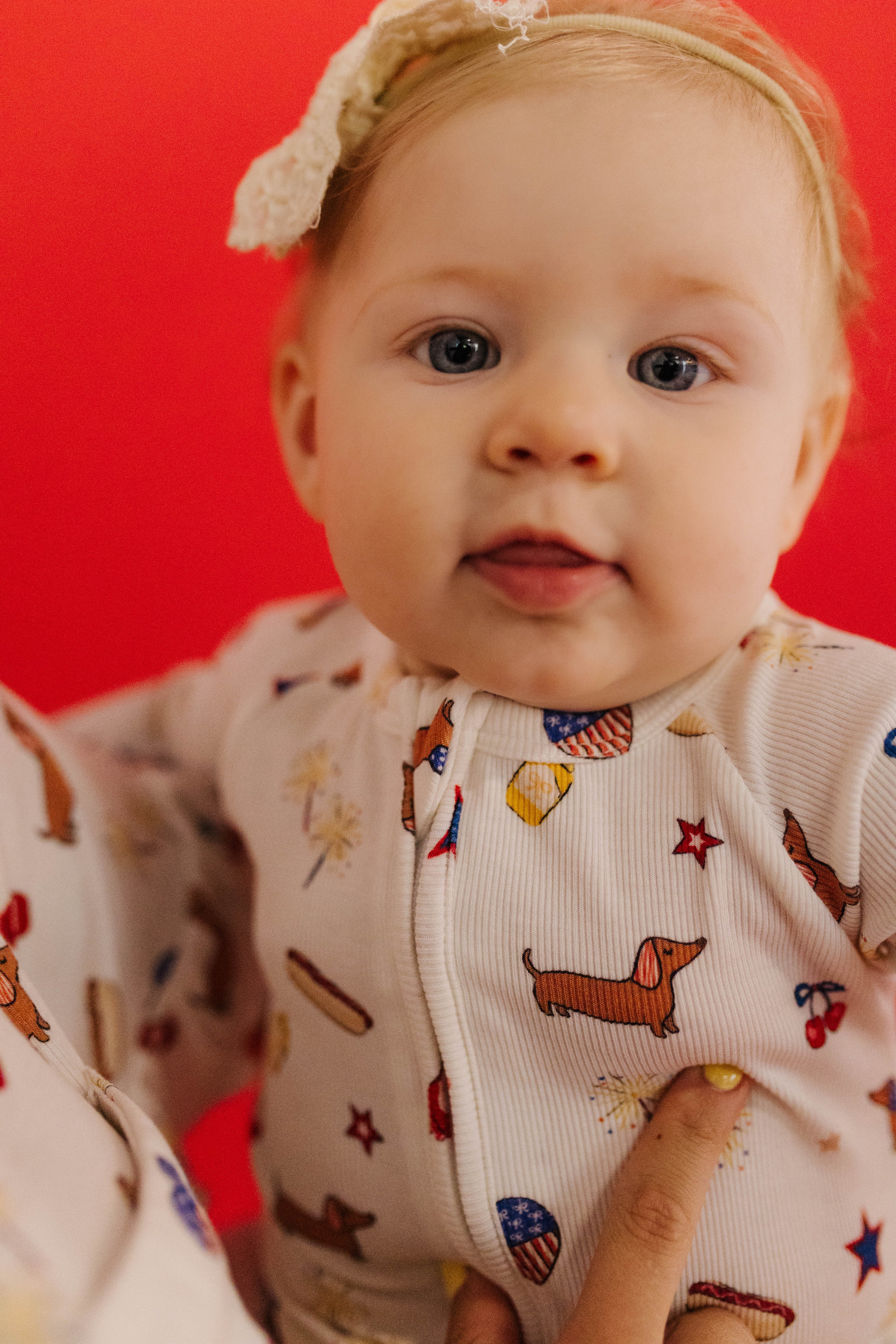 close pic of the baby in the pjs showing detail of the icons 