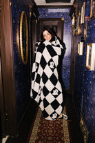 Model wrapped in the Ghost Check blanket