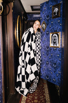 Ghost Check Blanket 60x80 shown in a full length lifestyle view