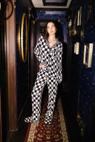 Front view of adult Ghost Check long pajamas on a model