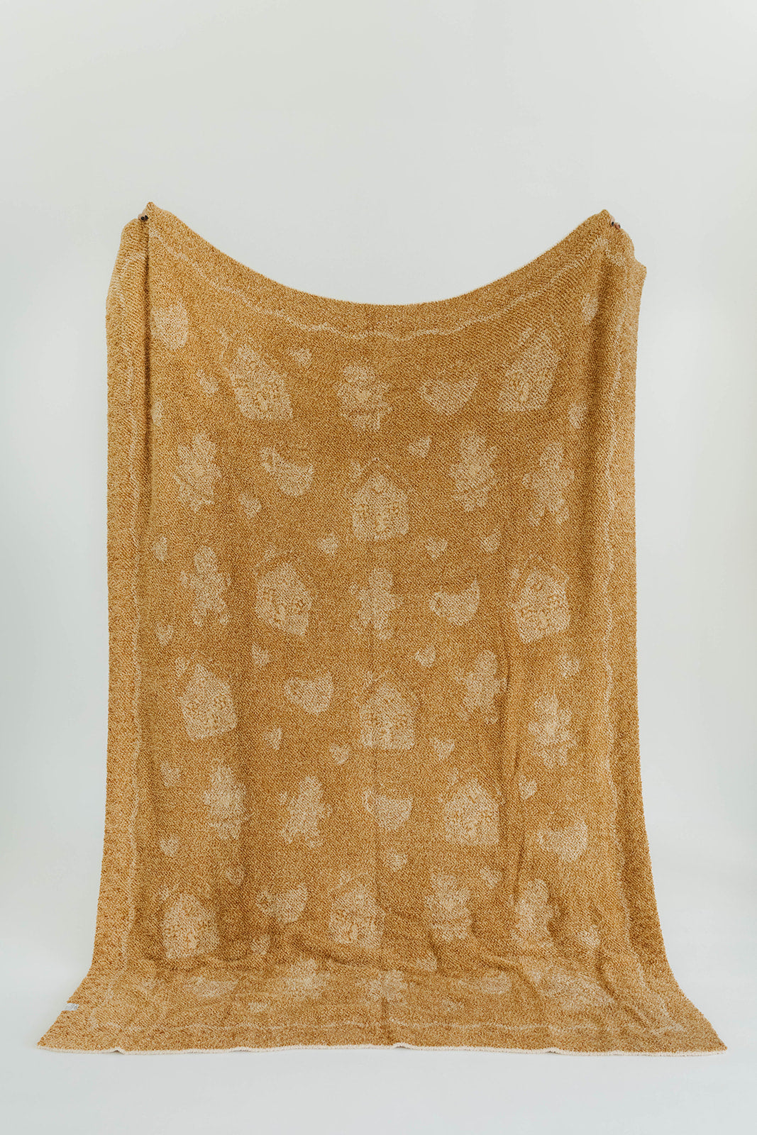 Brown textured fabric with a subtle pattern on a white background