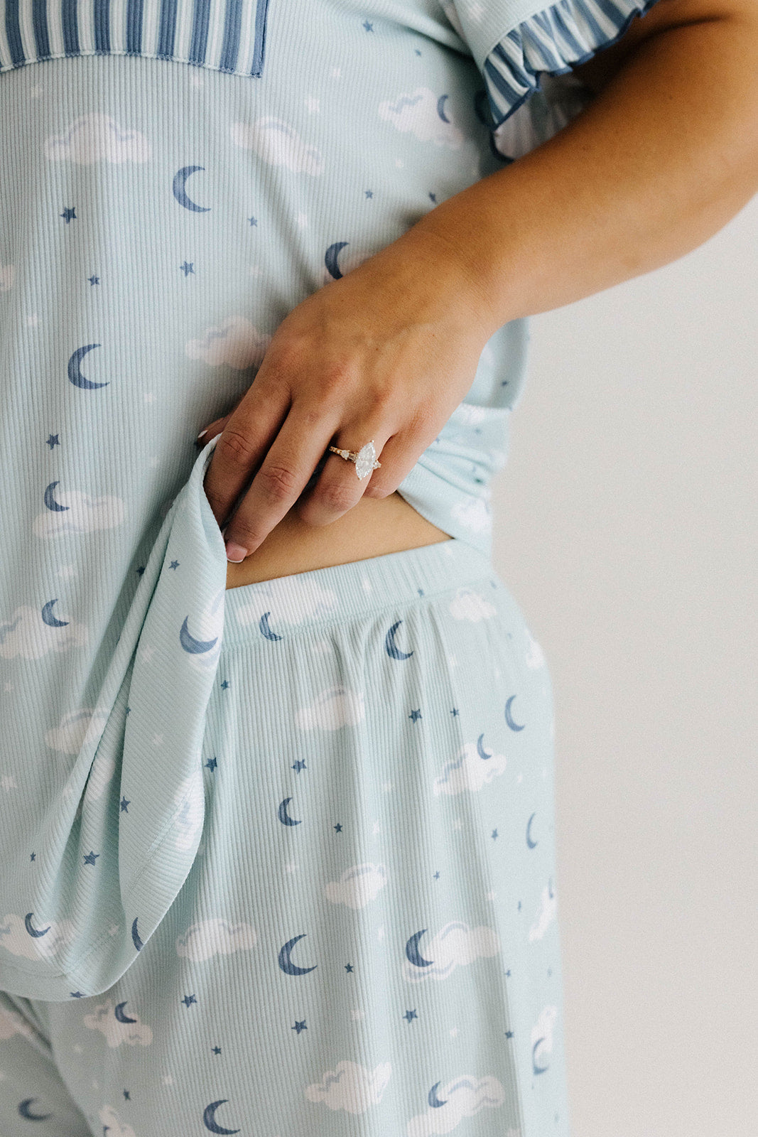 model showing the waistband of the cloud ruffle pajamas 